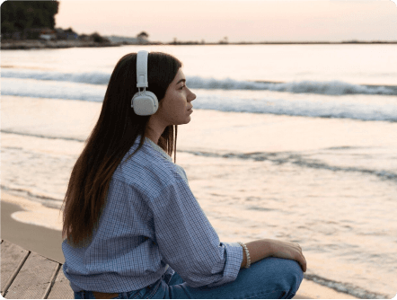 Person meditating on beach